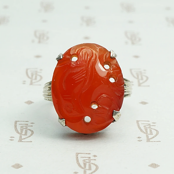 Carved carnelian is silver forget me not setting ring.