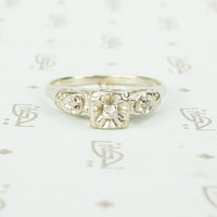 vintage white gold diamond set flower engagement ring