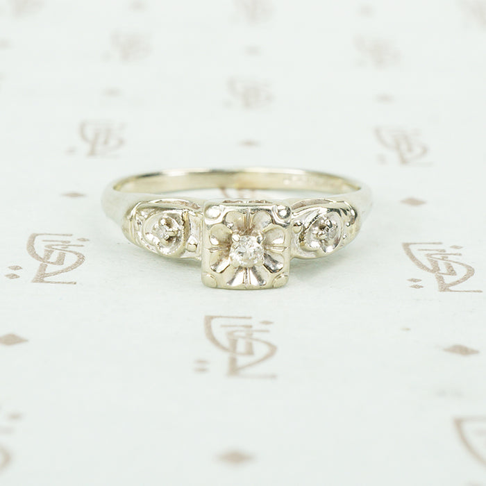 vintage white gold diamond set flower engagement ring
