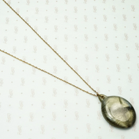 khaki green large celluloid sliding locket on a gold filled chain