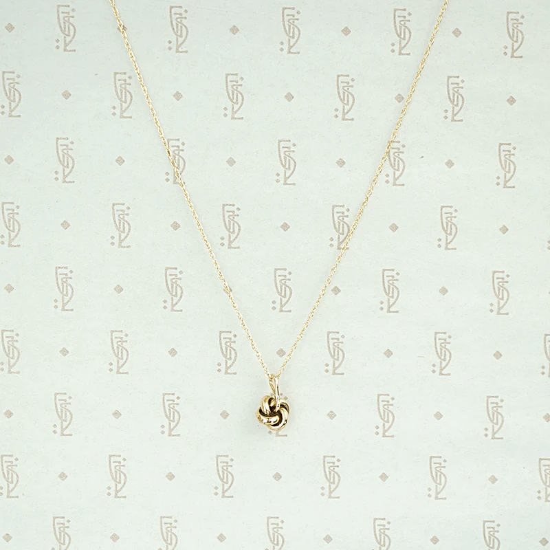 Tiny Love Knot Pendant With Pearl
