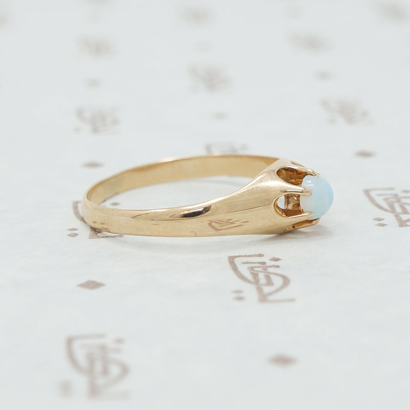 rose gold claw set opal ring side view