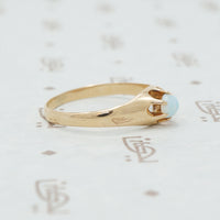 rose gold claw set opal ring side view