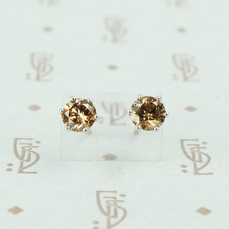 1 carat total weight cognac diamond studs in 18k white gold
