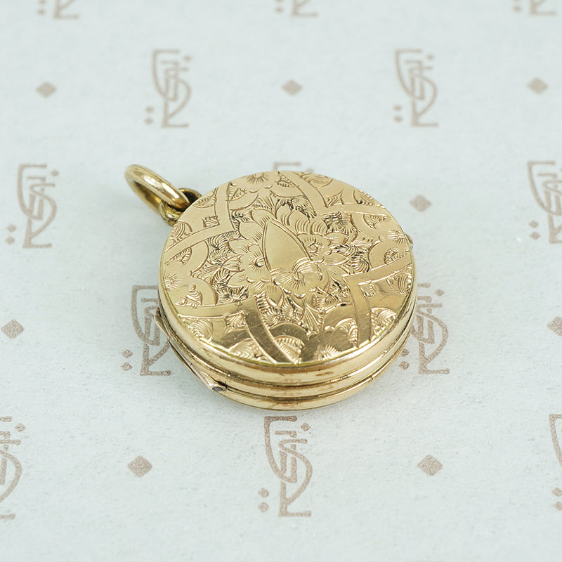 9ct locket with a 6 pence