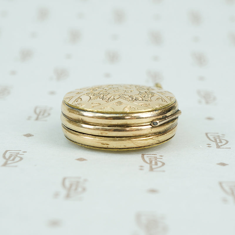 9ct locket with a 6 pence
