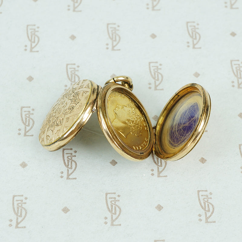 9ct locket with a 6 pence