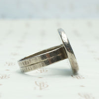 Roman Coin in Handmade Silver Ring, side view.