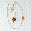 gold and coral acorn on gold rope chain