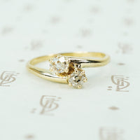 old mine cut diamond cross over yellow gold engagement ring