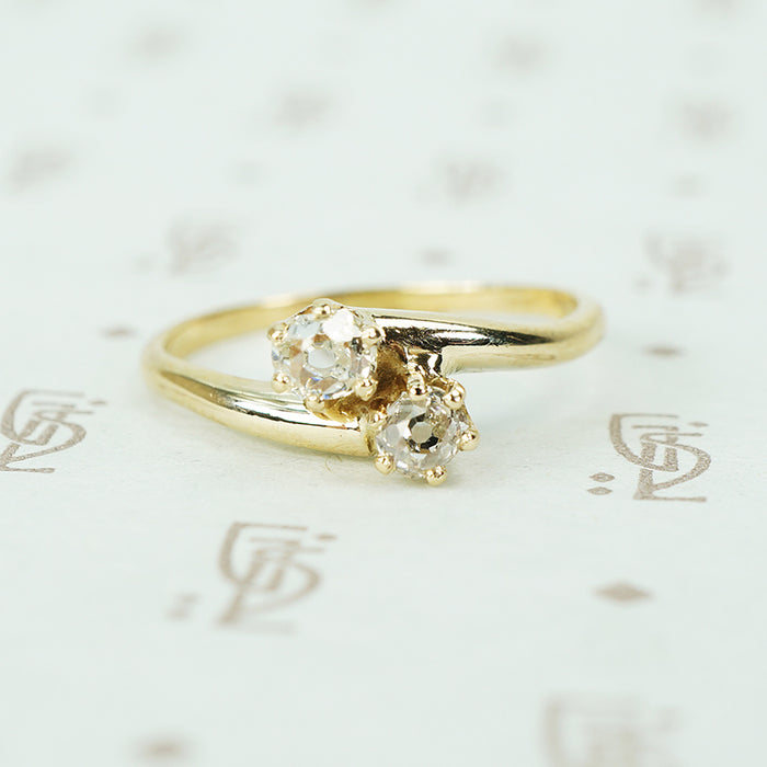 old mine cut diamond cross over yellow gold engagement ring