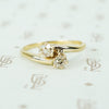 old mine cut diamond cross over yellow gold engagement ring