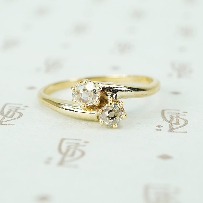 old mine cut diamond cross over yellow gold engagement ring