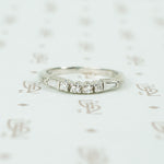baguette and round diamond curved platinum band 1940's