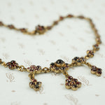 close up of czechoslovakian vintage garnet necklace rose cut