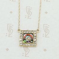 gold enamel and rose cut diamond necklace close up