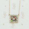 gold enamel and rose cut diamond necklace close up