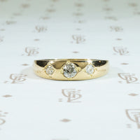three diamond 18k yellow gold gypsy band