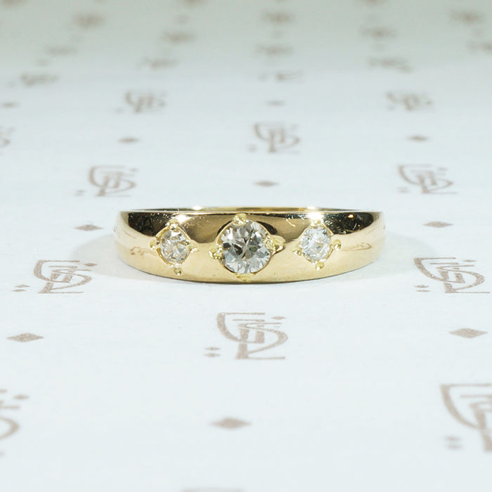three diamond 18k yellow gold gypsy band