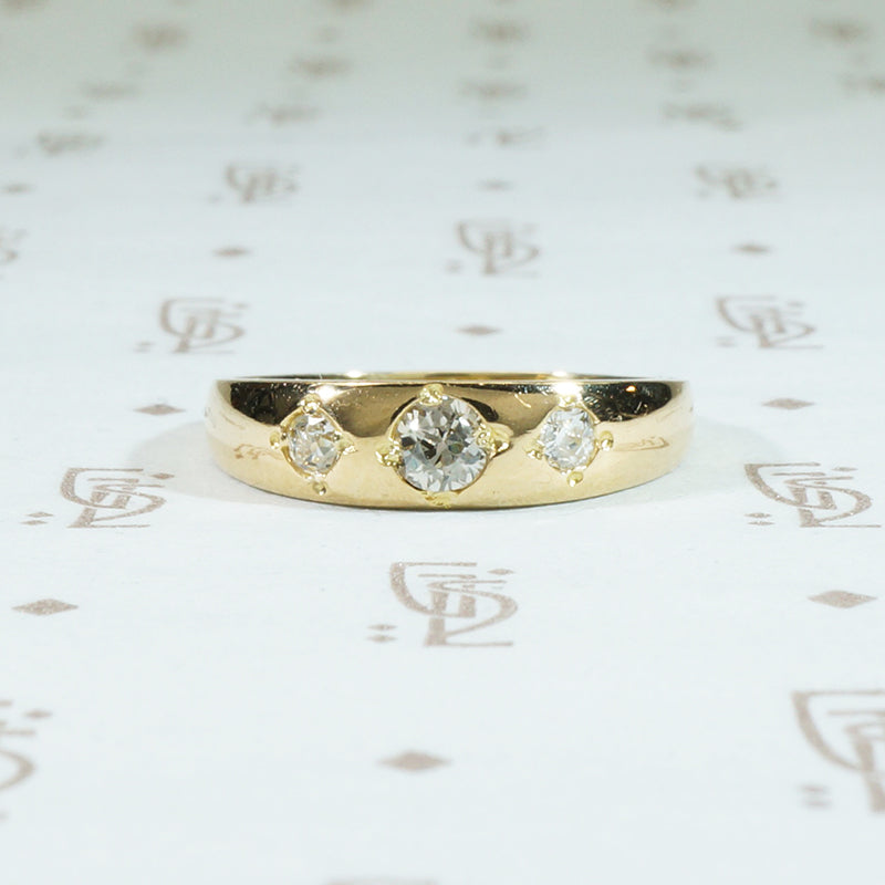 three diamond 18k yellow gold gypsy band
