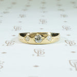 three diamond 18k yellow gold gypsy band