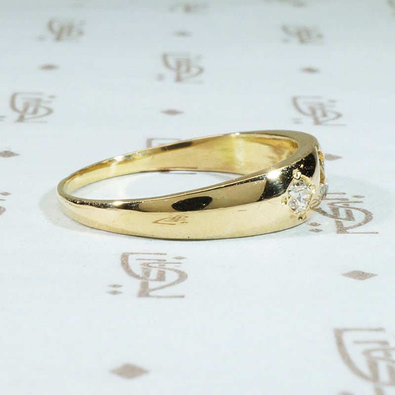 three diamond 18k yellow gold gypsy band