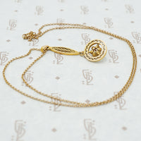 back view of 14k gold and diamond lavalier