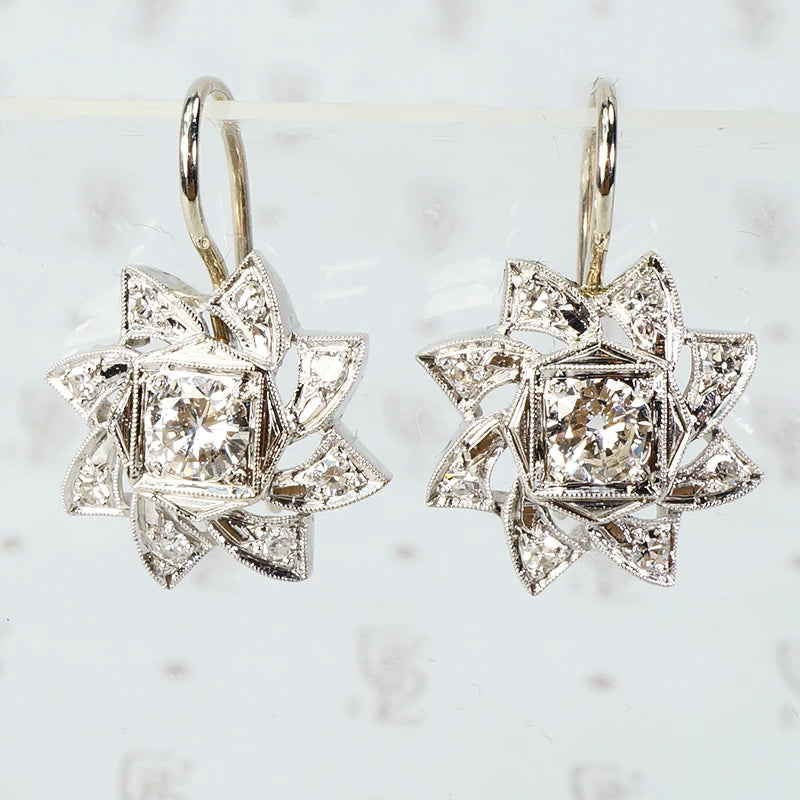 vintage 1940's 4k white gold and diamond pinwheel shaped earrings