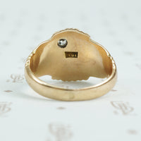 Gold signet ring with engraved j topped with a mine cut diamond back view
