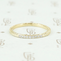 The diamond wheat band by 720 in yellow gold.