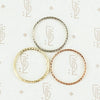 The diamond wheat band by 720 in yellow, white and rose gold in top view.