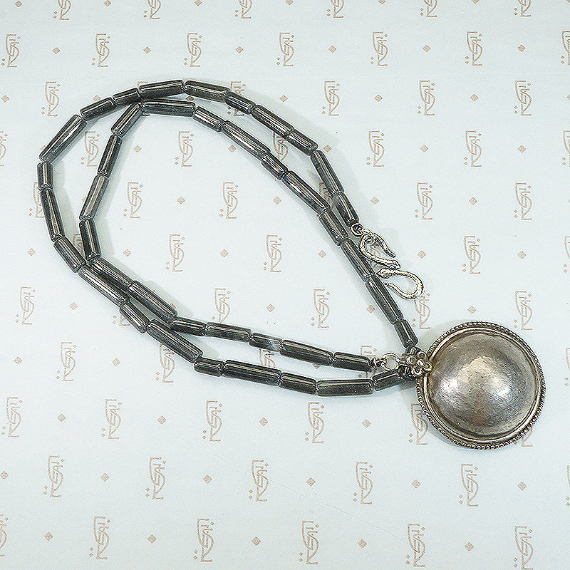 double snake clasp and hand hammered silver disc pendant