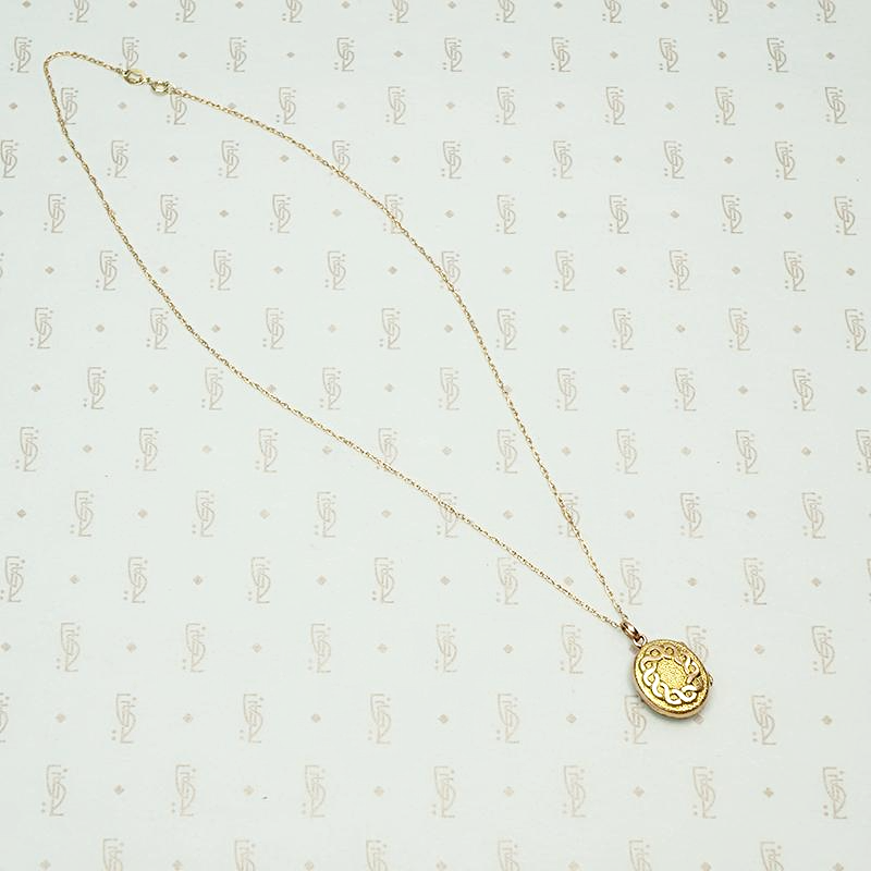 Two Tone Edwardian Locket with Graphic Details, chain detail.