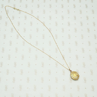 Two Tone Edwardian Locket with Graphic Details, chain detail.