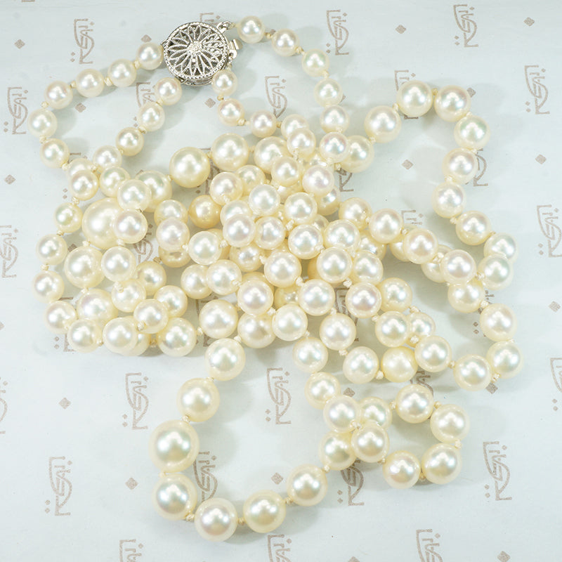 gorgeous double strand of pearls with fancy white gold filigree clasp