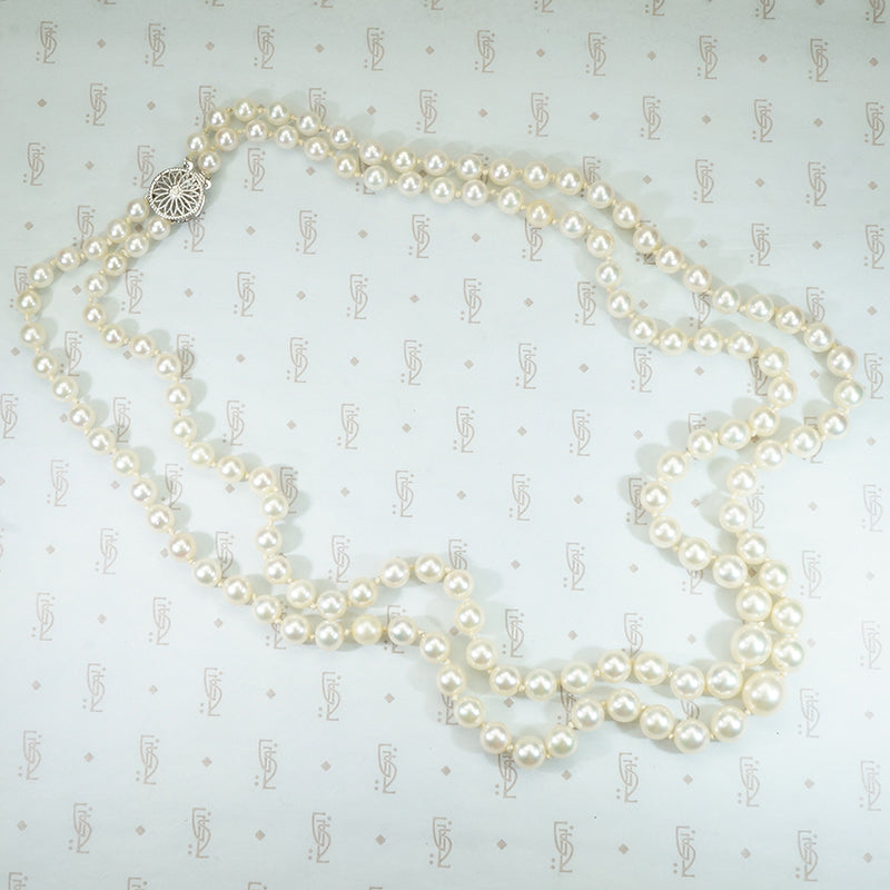 gorgeous double strand of pearls with fancy white gold filigree clasp