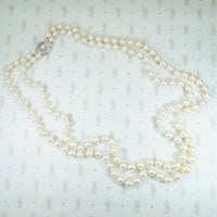 gorgeous double strand of pearls with fancy white gold filigree clasp