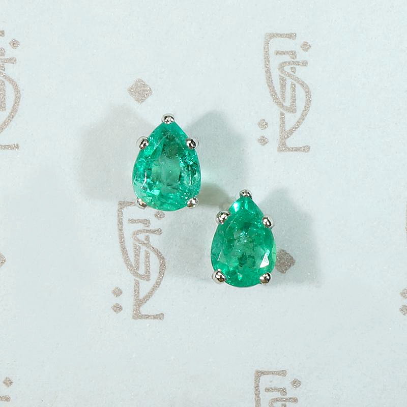 Vivacious Pear Cut Emerald Studs in Platinum