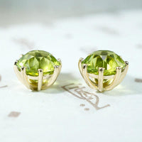 Glowing Green Peridot Studs in Gold Martini Settings