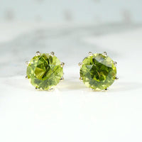 Glowing Green Peridot Studs in Gold Martini Settings