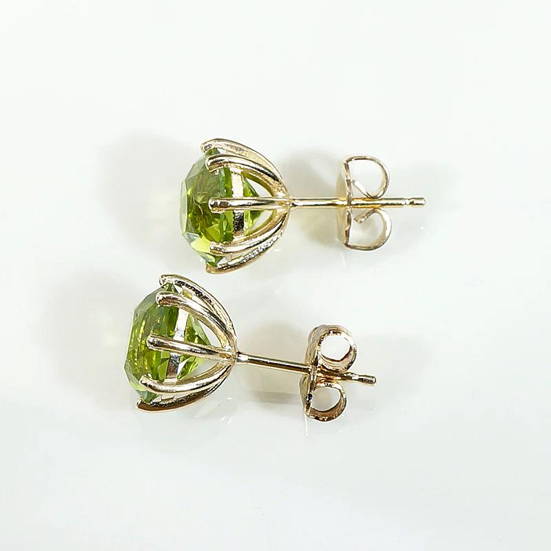 Glowing Green Peridot Studs in Gold Martini Settings