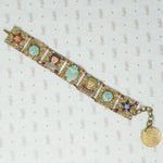 fun vintage egyptian themed bracelet brass filigree enamel and glass 
