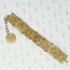 fun vintage egyptian themed bracelet brass filigree enamel and glass back view