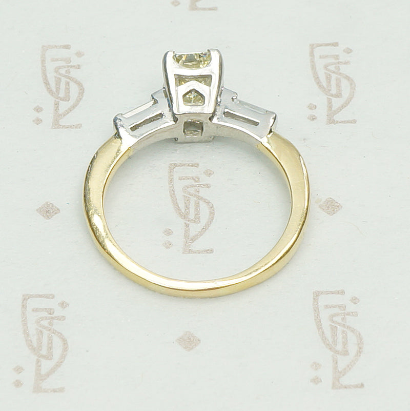 Classic and Unique Emerald Step Cut Diamond Ring