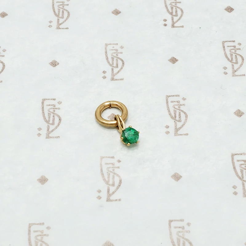 tiny emerald charm