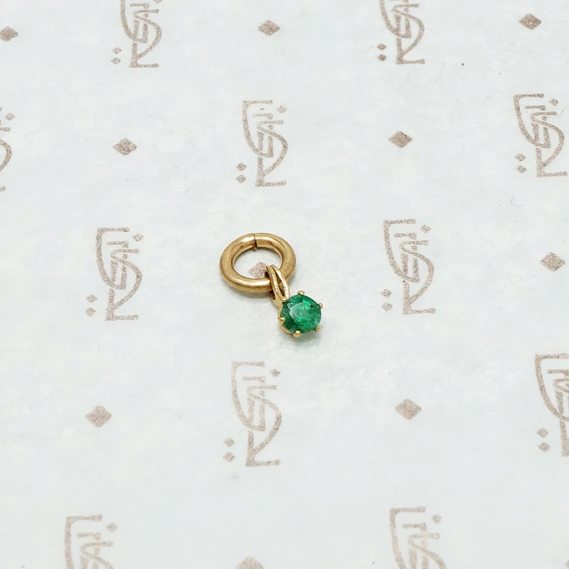 tiny emerald charm