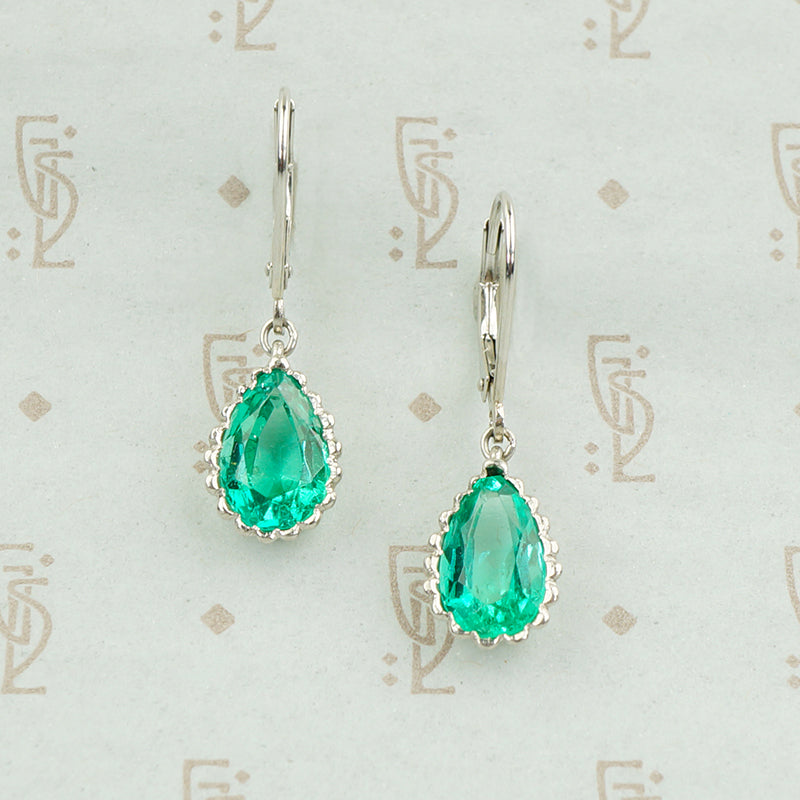 pear shaped emerald earrings platinum
