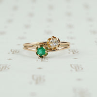 tulip set crossover ring emerald and diamond