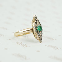 Old Chunky Diamond Navette Ring with an Emerald