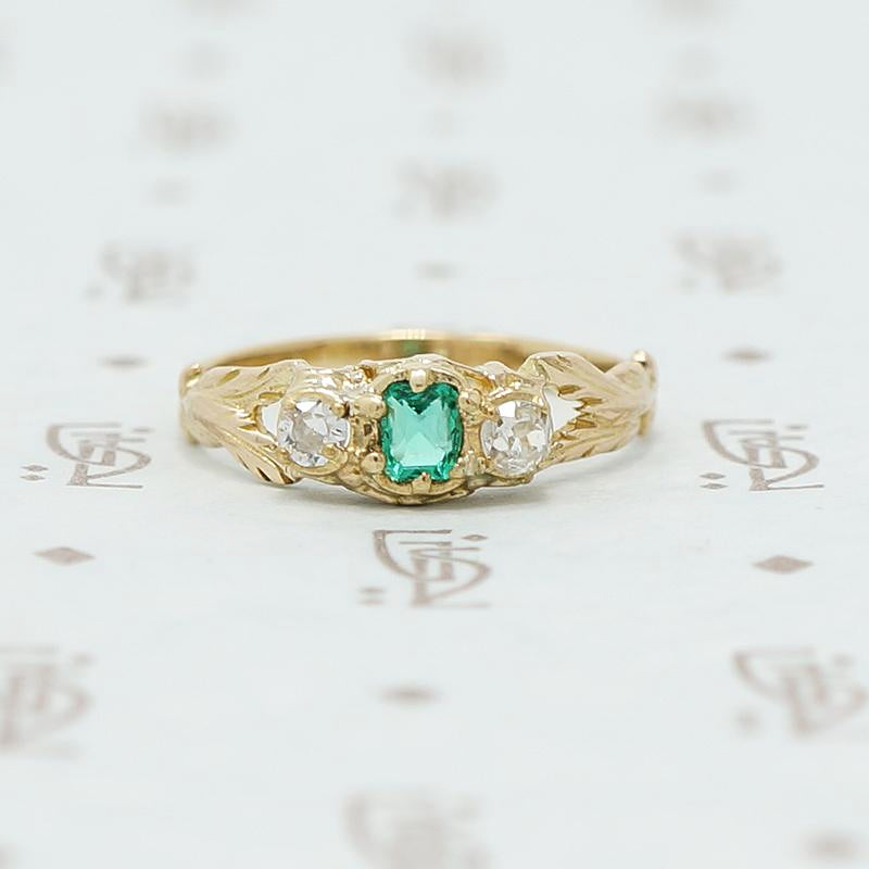 emerald and mine cut diamond ring